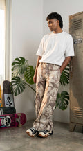 Beige Cotton Oversized Camo Cargo Pants feature a baggy fit with six spacious pockets